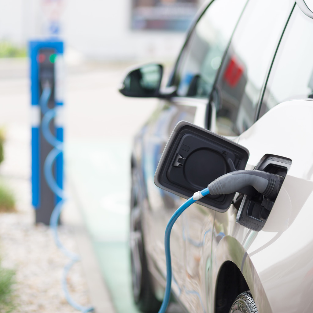 stock-photo-electric-car-in-charging-station.jpeg